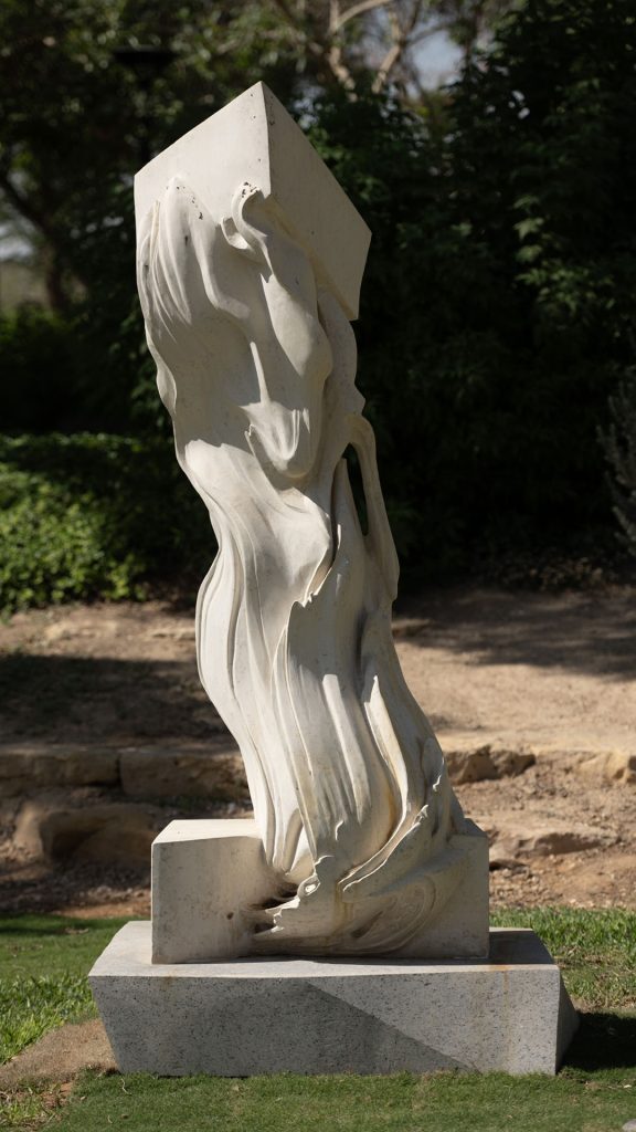Energy of Water (2023) by Vasilisa Chugunova, a stone sculpture with intertwining lines and emerging droplets, installed at King Abdulaziz Historical Center (KAHC) in Riyadh, symbolizing the transformative power of water.