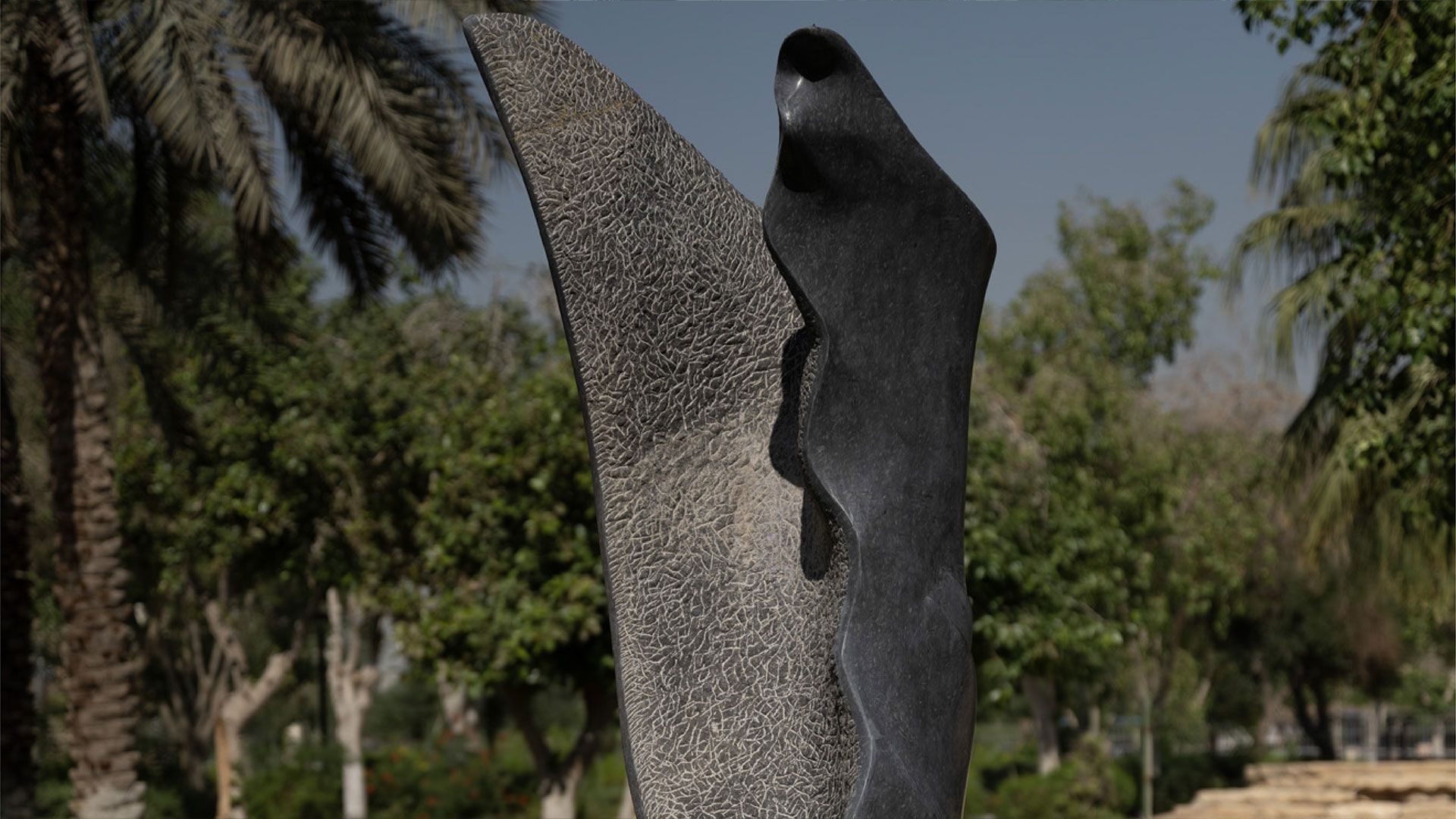 Damjan Komel’s Perseverance in Time (2021), a spiraling stone sculpture inspired by seeds, ancient symbols, and personal growth, installed in Riyadh as part of the artist’s Seeds of Light series.