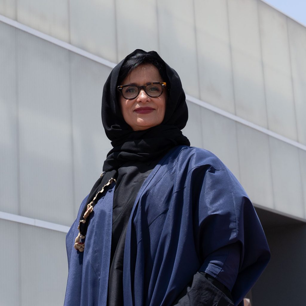 Portrait of Dr. Effat Abdullah Fadag, Saudi artist, curator, and professor of fine arts, pictured in Jeddah. She is known for her contributions to contemporary art, education, and the early women’s art movement in Saudi Arabia.