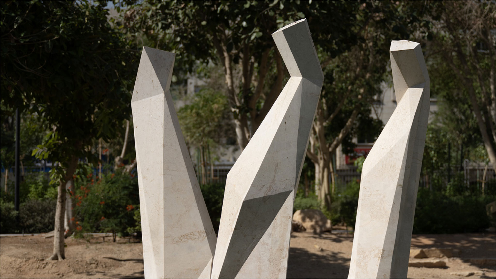Anna Korver’s The Lighthouses (2021), a triptych of faceted stone sculptures installed at King Abdulaziz Historical Center (KAHC) in Riyadh, abstractly referencing traditional Saudi dress and the protective symbolism of lighthouses.